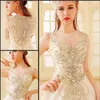 Luxury Crystal Bright Diamond Sexig bröllopsklänning Bollklänning Tulle Sheer Neck Lace Court Train Wedding Bridal Gowns With Big Bow