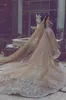 2018 Vestidos de novia de lujo con diamantes de imitación de Dubai con tren desmontable Escote de ilusión Vestido de novia de manga larga Precioso vestido de novia de sirena