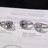 Ювелирные изделия бренда 925 Серебряное кольцо стерлингового кольца круглое нарезка 2CT Diamond Pink 2 Curround Pave Setring Cz Обручальные кольца для женщин два стиля размер 4-10