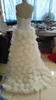 Högkvalitativ riktig bild hög lågt bröllopsklänning lyxfjäder brudklänningar pärlor paljetter kristaller spets topp handgjorda blommor dragkedja tillbaka