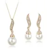 Gold romantico di alta qualità / argento placcato perla d'acqua d'acqua dolce angelo collana / orecchini di gioielli da damigella d'onore set per le donne