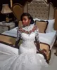 2022 Abiti da sposa a sirena africana di lusso Maniche lunghe Collo alto Illusion Appliques in pizzo Perline di cristallo Sheer Plus Size Abiti da sposa personalizzati