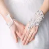 結婚式のフォーマルパーティーのための新しい到着の指のない結婚式の手袋の安いレースブライダルアクセサリー