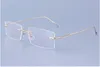 新しい到着簡潔なスタイルの男性のメガネフレーム品質チタン合金のリムレスゴールドシルバーガングレイライト耐久性卸売卸売販売