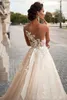 Splendidi abiti da sposa trasparenti castello 2022 Ball Illusion Back Appliques Abito da sposa con strascico in cappella in stile occidentale