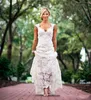 Vintage Bobo Lace Beach Wedding Dress Party Backless ärmlöst nyckelhål Back V Neck A Line Elegant Custom Made Bridal Clows