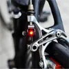 Wholesale- Hot sale brake bike light mini mountain bicycle light tail rear cycling red led lamp with CR1025 battery Cycling accessories