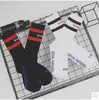 chaussettes noires brasselles blanches