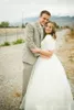 Modest Bröllopsklänningar med ärmar Billiga Högkvalitativa Scoop Neck Kortärmad Lace Top A-Line Informell Bridal Gown med Sash
