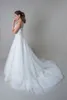 Illusion Boat Neck Bodice And Illusion Low, v- Back Straps Layers Upon Layers Of Tulle White Wedding Dress Bridal Gowns