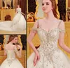 Bling Swarovski Crystal Ball Gown Wedding Dresses Off the Shoulder Lace Applique Tulle Chapel Train Vintage Backless Beaded Bridal