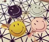 Wholesale- Lovely Cartoon Small Coin Purse Women's Purse Smiling Face Pill Eye Interesting Tassels Bag Pendant Girls Leather Wallet