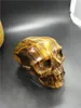 New product natural tiger-eye crystal skull Hand Carved tiger eye quartz skull for home decoration 1.12 kg