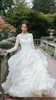 Chaple Dress Garden Ruffles Bröllopsklänning Långärmad Elegant Baklösa Sexig Tiered Kjol Billiga Pris Högkvalitativ Bateau Neck Golvlängd