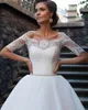 Abito da sposa a mezza manica con spalle scoperte Abito da sposa 2021 Appliques Pizzo Perle Cintura Bottoni Abiti da sposa lunghi fino al pavimento