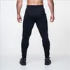 Мужские брюки Оптовые - 2022 Мужчины Мужчины Мужские Жулки Повседневные Фитнес-спорты Pantalon Homme Брюки Спортивная одежда Бодибилдинг штаны1