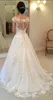 2019 NYA LANDS Modest Lace Appliques Wedding Dresses Sheer Bateau Cap ärmar Se genom knappen Back Golvlängd Brudklänningar Vestidos
