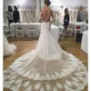 Sjöjungfru bröllopsklänningar 2016 med lager Tulle Overskirts Sheer Back Neckline med långa ärmar och bälte train tåg brudklänningar