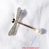 Najwyższej jakości błyszczący kryształ Rhinestone Pearl Dragonfly Broszka Szpilki Dla Kobiet Dziewczyna Wedding Bride Bukiet Broszki Biżuteria Hurtownie Xmas Prezenty