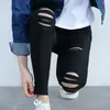 韓国の春の秋の女性が破壊されたズボンカピリスボーイフレンドの穴の薄いズボンスタイリッシュな女性の長い細い鉛筆ホールジーンズファッション