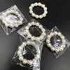 100ピース/ロット白真珠のナプキンリングの結婚式のナプキンバックルウェディングレセプションパーティーテーブルの装飾用品I121