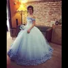 Lichte hemel blauwe baljurk trouwjurken 2017 zomer off schouder met handgemaakte bloemen tule puffy bruidsjurken op maat gemaakte vestidos