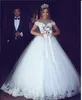 2020 New Modest Cheap Arabic Ball Gown Wedding Dresses Plus Size Lace Applique Off Shoulder Puffy Tulle Sweep Train Formal Bridal Gowns