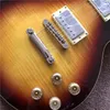 Jeden kawałek ciała i szyi w kolorze sunburst z żółtymi wkładkami, modernizacja mostu Tune-o-Matic z kremową Frets End Binding Guitarra
