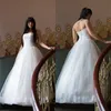 Abiti da sposa vintage a trapezio con corsetto in tulle con applicazioni di pizzo, lunghezza del pavimento, abiti da sposa senza schienale con lacci, abito su misura