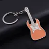 Nyckelringar Lanyards Musical Instrument Key Ring Enamel Guitar Keychain Holders Bag hänger Charms Fashion Jewelry Accessories Drop Ship 240238 i7WD