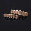 الهيب هوب الجسم مجوهرات 6 الأسنان grillz الذهب شغلها أعلى أسفل الأسنان فانغ grillz مجموعة للنساء men s هالوين عيد الميلاد حزب مصاص