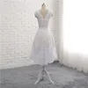 シャンパンサテンの背中の白い結婚式のブライダルガウンレアル写真と短い高値の白いウェディングドレス