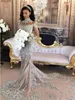 High Neck Mermaid Sexig stil Brudklänningar med Sier Applique pärlstav lång illusionärmare skräddarsydda bröllopsklänningar sveptåg
