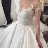 Backless Gelinlik sayesinde Klasik Romance Saten Gelin Giydirme Şeffaf Jewel Kısa Kollu Dantel Aplike Big Bow Gelinlik Seksi görün