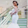 2018 Nueva sirena africana vestido de novia de lujo de encaje fuera del hombro con cuentas de tul sweep tren vestido de novia botón cubierto cubierto nupcial vestidos