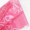 100pcs / mycket rosa poly pe mailer Express Bag 28 * 42cm Mail Bags Love Heart Envelope Självförsegling Plastpåsar för smycken Tjejprodukt