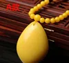 La cire d'abeille jaune ambrée à l'huile de poulet naturelle jade Lixin tombe avec les hommes et les femmes âgés la chaîne de chandail ambre
