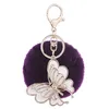 Echte konijnenbont Pom Poms Bal Sleutelhanger Crystal Butterfly Charms Zachte Bontbal Goud Metalen Sleutelhangers Pluche Auto Sleutelhanger