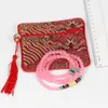 Vague petite fermeture éclair porte-monnaie pochette chinois soie bijoux pochettes sac cadeau gland crédit porte-carte femmes Bracelet pochette 10 pcs/lot