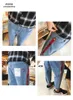 2018 printemps et été nouveaux jeans de réverbère hommes, épissage sangle jeans minces hommes mode harem neuf hommes