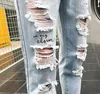 Byxor manlig koreansk version av trenden sommarhål jeans män slim raka vildpojkar nio byxor 9 poäng