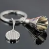 Creatieve geschenken accessoires badminton en racket sleutelhanger shuttle badminton racket sleutelhanger sleutelhanger