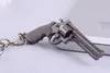 6 centimetri in miniatura revolver pistola arma modello di moda portachiavi portachiavi nuovo mini pistola portachiavi per gli uomini gioielli regalo a sorpresa