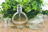 Hurtowe niesamowite butelki dołupkowe szkła 25ml puste butelki pompy perfumy ze srebrnym opryskiwaczem i czysta czapka