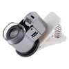 65x ZOOM Clip-on Microscope LED + UV Light Förstoringsglas Mikrolins för mobiltelefon Smycken Mynt Frimärsmikroskop