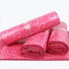 100pcs / mycket rosa poly pe mailer Express Bag 28 * 42cm Mail Bags Love Heart Envelope Självförsegling Plastpåsar för smycken Tjejprodukt