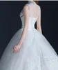 Perlenbesetztes Kristall-Tüll-Ballkleid-Hochzeitskleid Vintage 2019 Juwelenhals-Brautkleid mit offenem Rücken