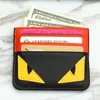Cartão do cartão de grife Cartão de carteira de couro falsificado Pequenos olhos clipe Bank Bag masculino Super Slim Wallet7445389