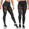 Fitness Kläder Kvinna Europa och Amerika Plus Storlek Fast Torra Byxor Sport Tight Hollow Sports Running Yoga Pants Leggings