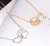 Hot style Simple European and American pet paw paw heart pendant with hollow clavicle chain necklace is fashionable and classic